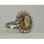 DIAMOND AND WHITE SAPPHIRE CLUSTER RING, a vintage gem set, circa 1950, mounted in white metal.