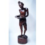 THAI FIGURE, carved wooden figure holding a circular dish, 123cm H.