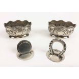 VICTORIAN SILVER SALTS, a pair, shaped rims, embossed half gadroon and 'C' scroll decoration,