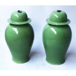 TEMPLE JARS, a pair, Chinese leaf green ceramic ginger jar form with lids, 56cm H.