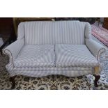 SOFA, 20th century two seater upholstered in ticking fabric raised on cabriole supports,