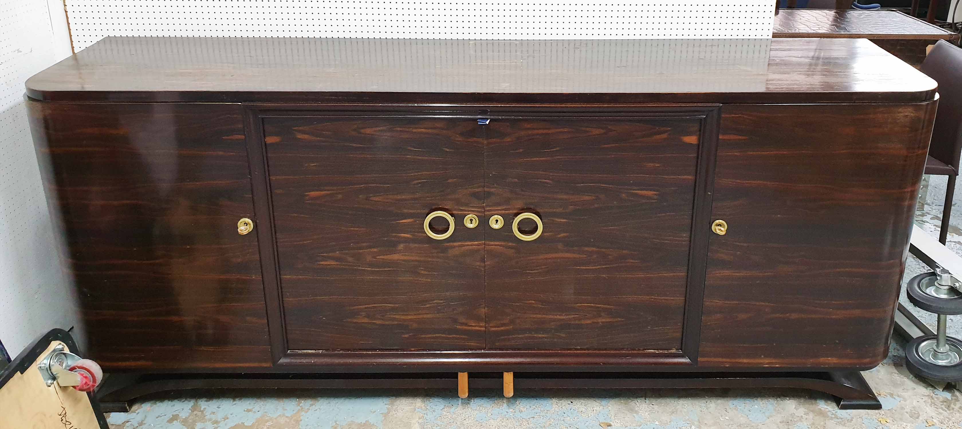 SIDEBOARD, 1940s in coromandel with shelves and centre cupboard with two drawers,