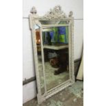 WALL MIRROR, late 19th century French cream painted with an ornate leaf,