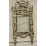 WALL MIRROR, 19th century Italian silvered wood with multiple plates in foliate,