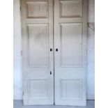 DOORS, a pair, salvage early 20th century mahogany distressed white painted each with three panels,