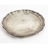 SILVER SALVER, shaped edge on three bun feet, 24.5cm D, Birmingham 1929, Joseph Gloster Ltd, 13.4oz.