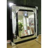 WALL MIRROR, Venetian style with a central rectangular bevelled plate and foliate effect decoration,
