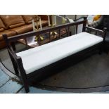 CONSERVATORY BENCH, with a white cushion, 197cm W x 85cm H.