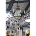 WITHDRAWN CHANDELIER, of substantial proportions, twelve branch, gilt metal with glass droplets,