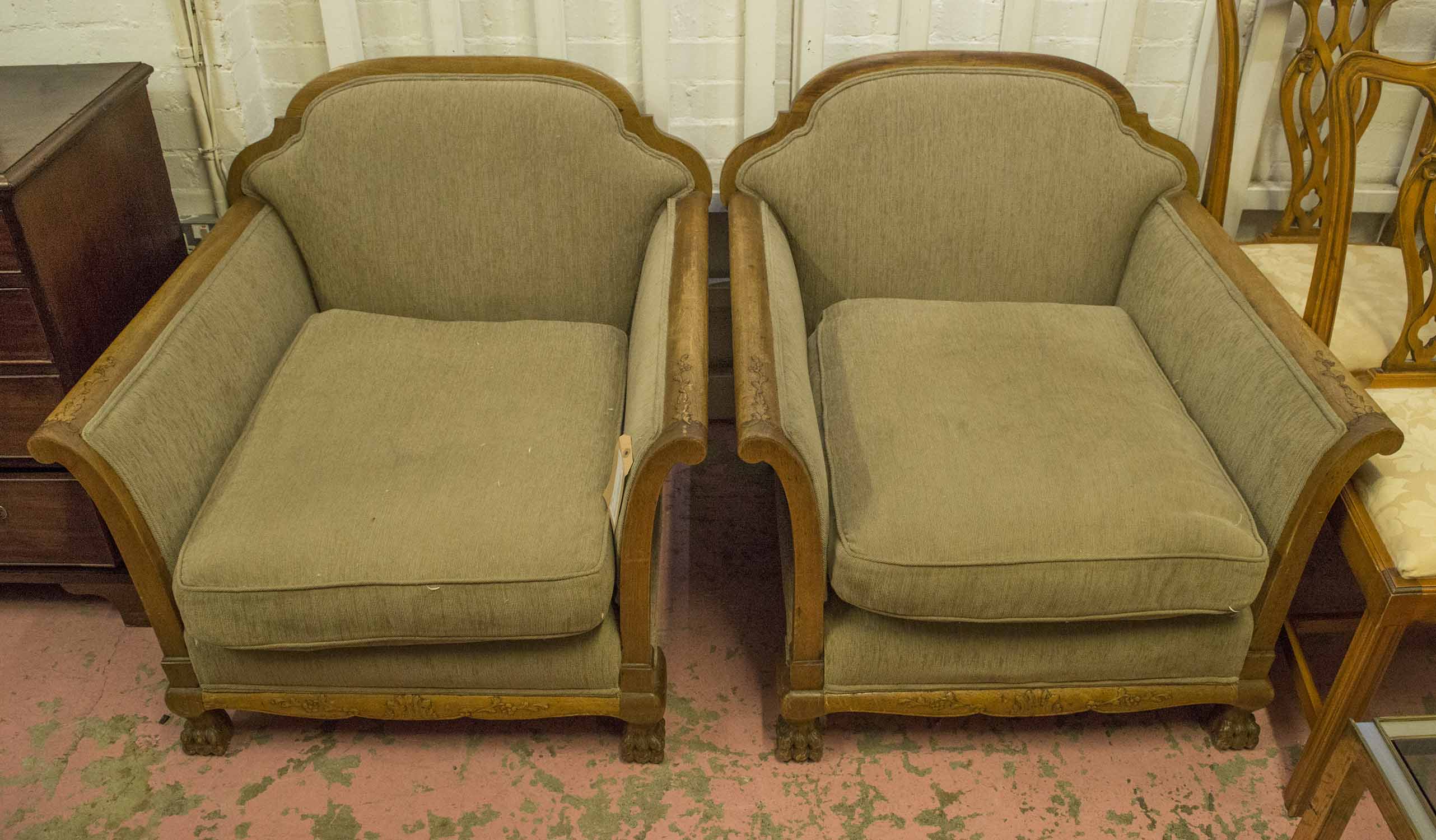 ARMCHAIRS, a pair, early 20th century walnut with carved showframes and oatmeal upholstery,