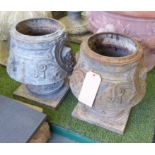 GARDEN PLANTERS, a pair, in distressed metal with decorative detail with classical masks,