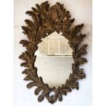 WALL MIRROR, George III style carved giltwood with oval plate and acanthus wreath frame,