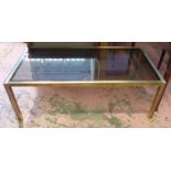 LOW TABLE, the smoked glass top on a metal and brass frame, 122cm x 61cm x 45cm H.