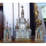 CLOCK ET GARNITURE, of ecclesiastical form, 45cm H x 27cm.