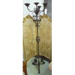 FLOOR CANDELABRUM, late 19th/early 20th century scrolled wrought iron with four sconces, 178cm H.