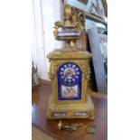 MANTEL CLOCK, gilt with a blue porcelain dace with cherub detail, 54cm H x 26cm.