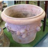 TERRACOTTA PLANTERS, a pair, large with fruit detail, each 65cm W x 55cm H.