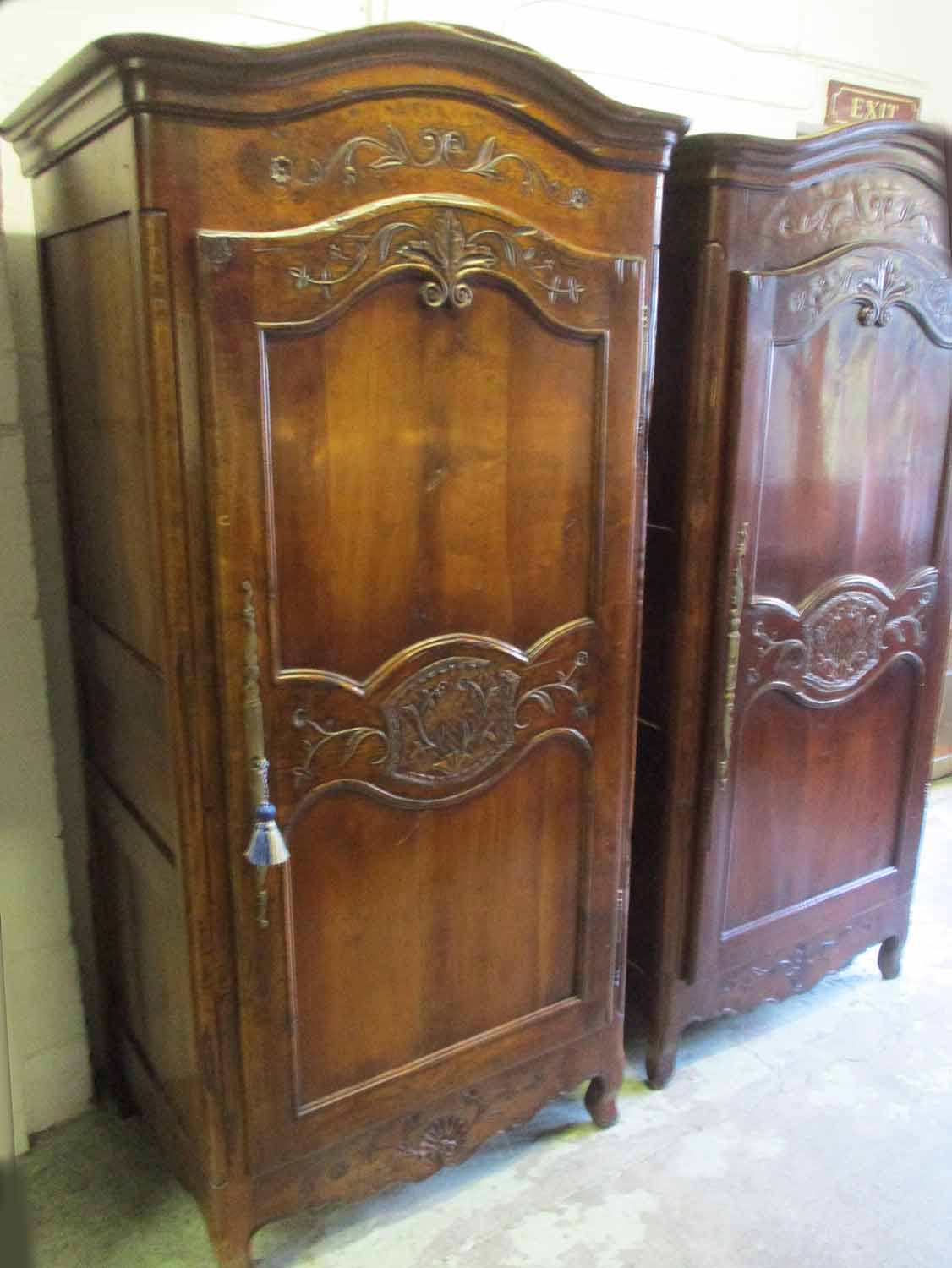 BONNETIERE, French Louis XV manner cherrywood with an arched cornice,