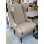 ANDREW MARTIN WINGBACK ARMCHAIR, in beige with studded arms on square supports, 86cm W.