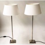 LAMPS, a pair, chromed slender pillar and stepped square base, 74cm H.