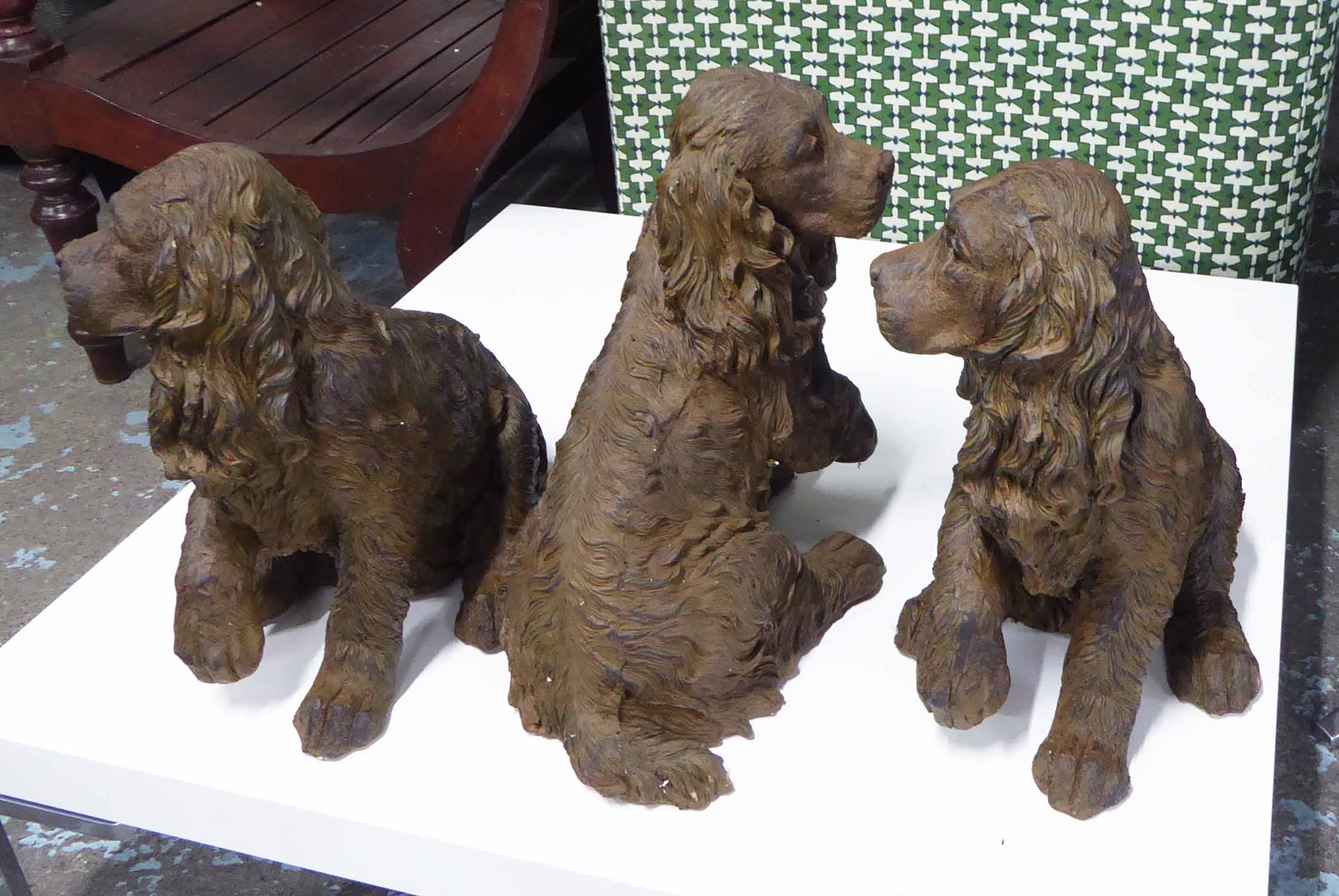 COCKER SPANIELS, a set of three, stylised ceramics, 42cm h.