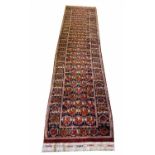 FINE AFGHAN BASHIR RUNNER, 310cm x 75cm, field of medallions within a stylised boteh border.