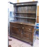 DRESSER, George II oak the rack with two shelves over a base with a drawer and two cupboards,