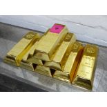 FAUX GOLD BULLION BARS, eight bricks with Canadian seal, 24cm x 9cm x 4cm.
