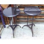 SIDE TABLES, a pair, with black circular granite tops on triform metal supports with claw feet,