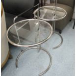 EILEEN GREY STYLE SIDE TABLES, a pair, circular with glass tops on chromed metal supports,