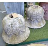 URNS, three reconstituted stone with leaf detail, each 72cm H x 49cm W.