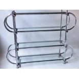 DISPLAY STAND, architectural chrome tubular with four glass shelves, 170cm x 128cm H x 42cm.