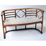THONET BENCH, mid 20th century bentwood with curved lattice back with paper label, 124cm W.