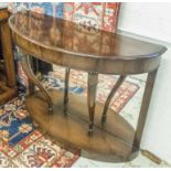 CONSOLE TABLES, a pair, demi lune mahogany with mirrored backs and shaped ebonised supports,