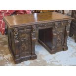 PEDESTAL DESK, late 19th century Continental oak with three drawers above carved panel doors,