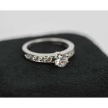 TIFFANY RING, round brilliant cut diamond 40 carat, V52 color G, medium blue, size I/J,