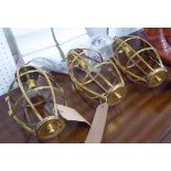 CHARLES EDWARDS HANGING CAGE LIGHTS, three, made in brass, each 36cm H x 17cm Diam.