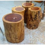 ANDREW MARTIN ROUND WOODEN LOG TABLES, a set of four, 47cm H tallest.