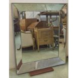 WALL MIRROR, silvered rectangular frame with canted border plates, 130cm x 110cm.