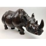 CLEMENT 'RHINOCEROUS', carved wood sculpture 29cm H x 62cm L.