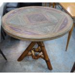 BAMBOO TABLE, round top with distress multicoloured top on cross framed bamboo, 90cm diam x 75cm H.