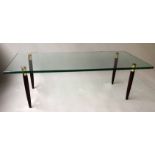 DENMARK LOW TABLE, rectangular plate glass on gilt metal tipped wood supports,