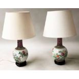 LAMPS, a pair, Chinese ceramic gourd vase shaped floral decorated with wooden bases, 38cm H.