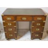 CAMPAIGN DESK, Victorian mahogany and brass bound with green leather top above nine drawers,
