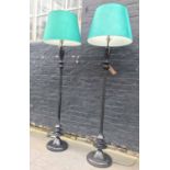 STANDARD LAMPS, a pair, black painted turned columns with green Pooky Taj silk shades, 170cm H.