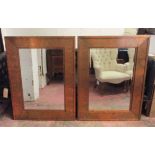 WALL MIRRORS, a pair, rectangular mottled copper, each with a central bevelled plate, 91cm x 122cm.