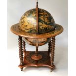 GLOBE COCKTAIL CABINET, of large proportions, in the form of an antique globe on stand,