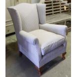 WINGBACK ARMCHAIR, newly upholstered in ticking fabric, on cabriole supports, 77cm W x 93cm H.