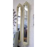 PIER GLASSES, a pair, with cream frames and bevelled plates, 130cm H x 20cm W.