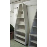 PYRAMID SHAPED BOOKCASE, in Farrow & Ball Cornforth White with a ball finial enclosing shelves,